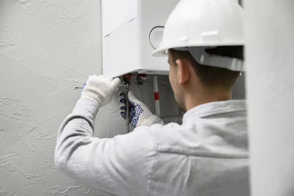 plumber fixing water heater